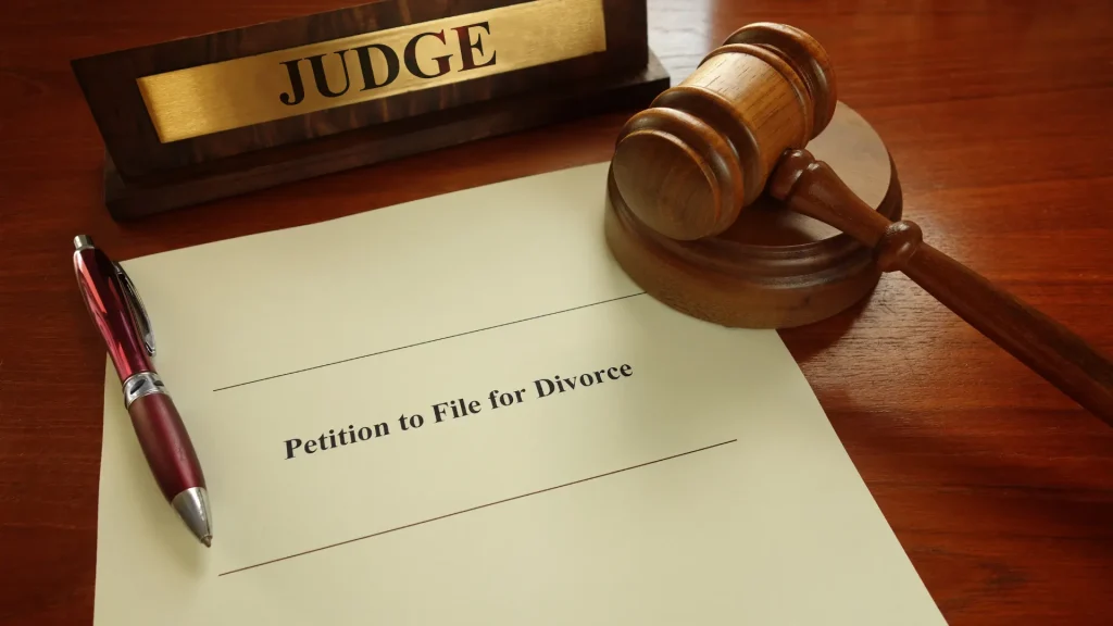 Gavel beside two clipboards with contracts
