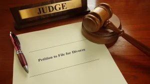 Gavel beside two clipboards with contracts